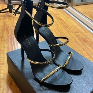 Bebe Black Stilettos with Gold Accent Straps